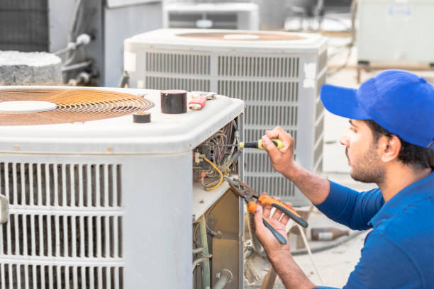 Adnanfixit AC technician servicing an air conditioner