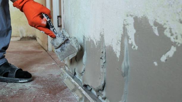 Wall preparation and crack filling before painting in Dubai