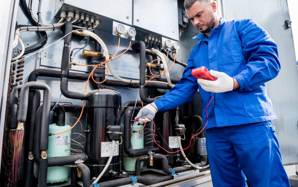 Adnanfixit technician repairing a commercial chiller in Dubai